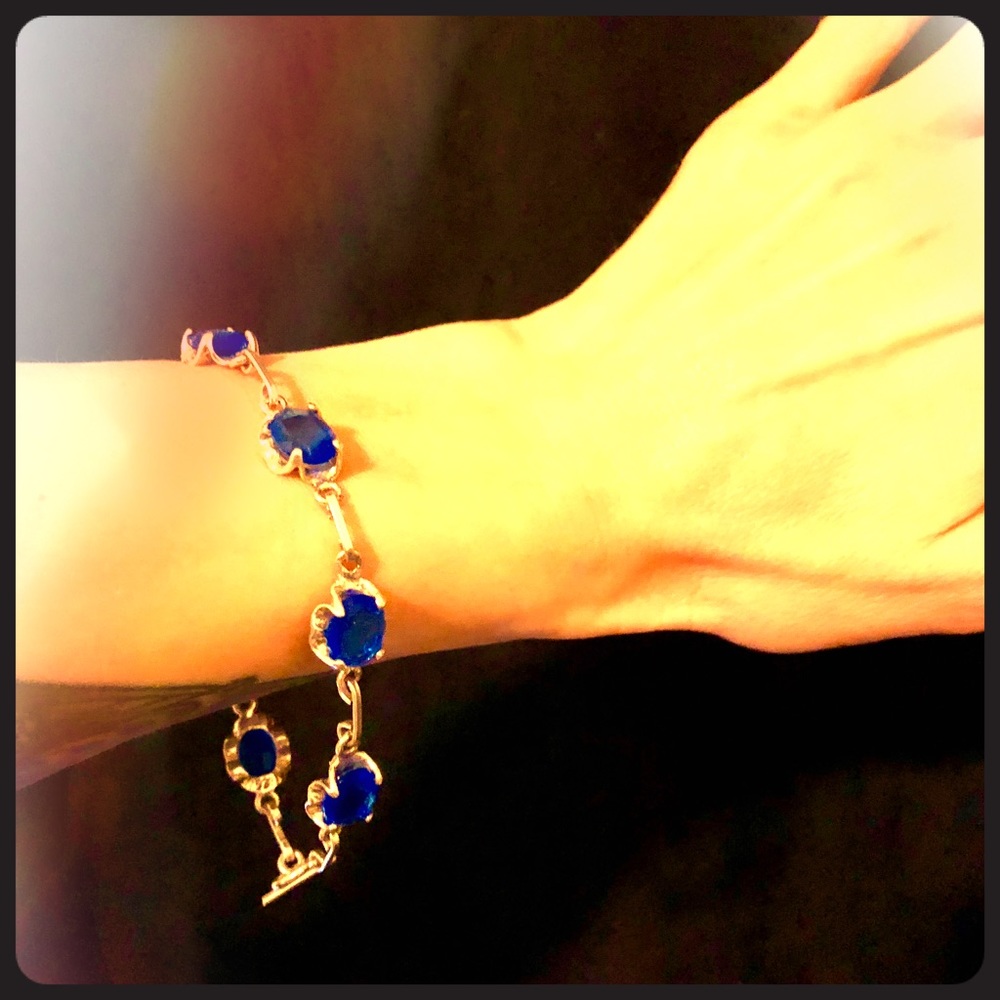 Silver metal and blue glass bracelet